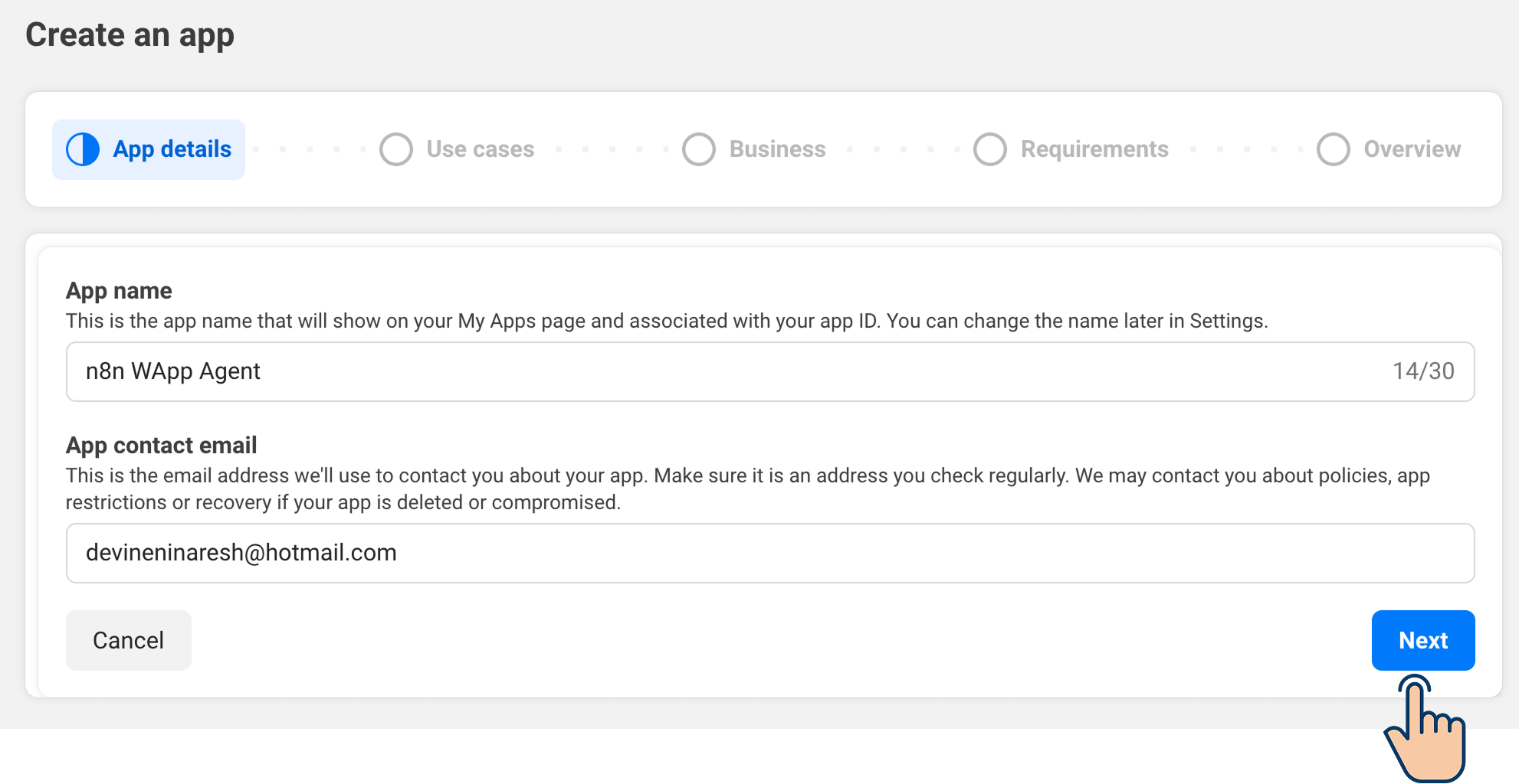 "Create an app" form β App details step with app name and contact email filled in; cursor pointing at the Next button.