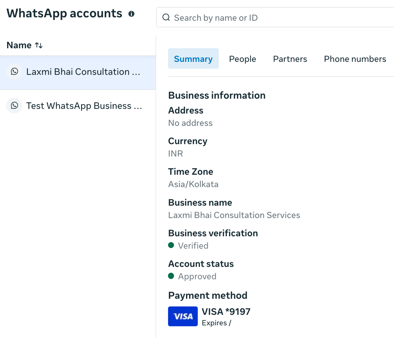 WhatsApp Business Manager Summary tab showing "Laxmi Bhai Consultation Services" as verified and approved, with a VISA card listed as the payment method.