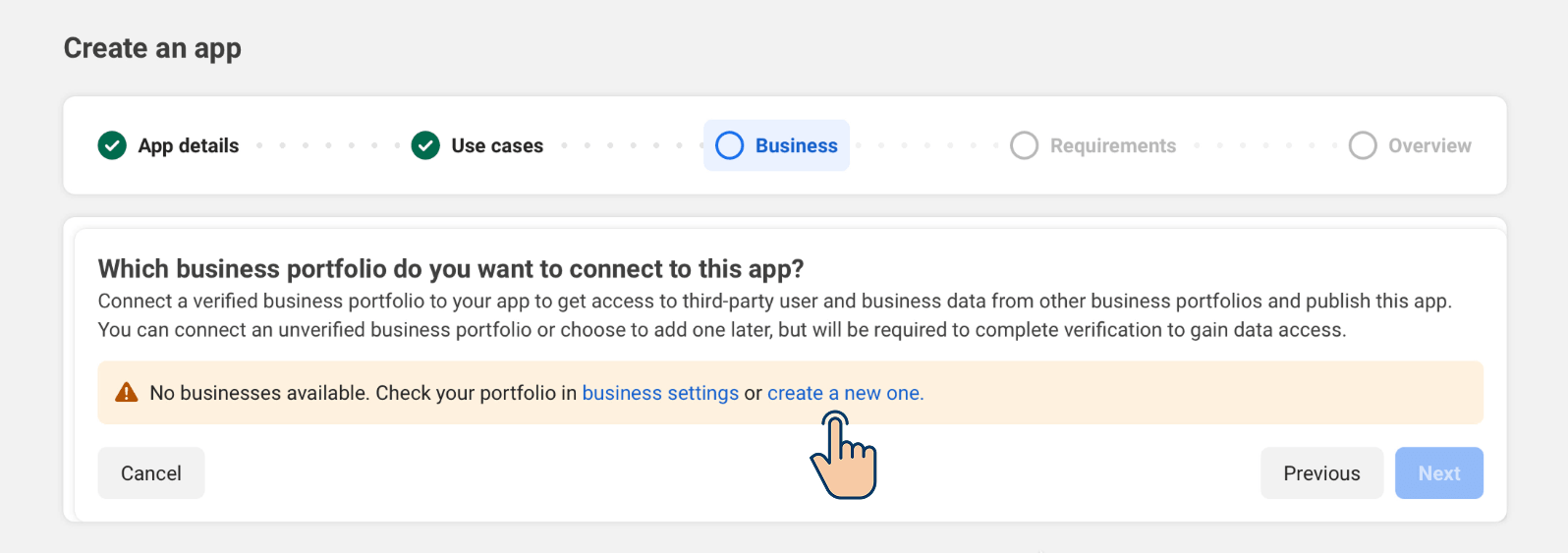 Meta "Create an app" wizard on the Business step, showing a warning: "No businesses available. Check your portfolio in business settings or create a new one." A cursor points to the "create a new one" link.