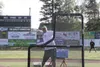 Mat-Su Miners head coach Ben Taylor throws batting practice during a team practice Friday evening at Hermon Brothers Field in Palmer. The Miners open the 2014 season tonight at 5 p.m. in Chug