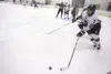 ROBERT DeBERRY/Frontiersman Houston forward Jake Wells moves the
puck out of the corner Thursday against the Juneau-Douglas Crimson
Bears at the Curtis D. Menard Memorial Sports Center in
Was