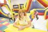 ROBERT DeBERRY/Frontiersman Bouncin' Bear owner Christie Simpson
stands on one of the inflatable play structures inside her new
entertainment center.
