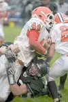 ROBERT DeBERRY/Frontiersman Colony senior Ty Farber tackles West
fullback Terry Holtman during a 7-6 loss to the Eagles last
Friday.