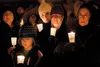 Valley residents gather near the Palmer Train Depot for a candlelight vigil for MY House, a nonprofit organization that makes available the basic needs of safety, shelter, warmth and nourishm