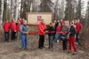 Wasilla Mayor Bert Cottle and Wasilla High cross-country running coach Leslie Varys cut the ribbon at the Maureen McCombs Equestrian Trail during a ceremony Tuesday afternoon.