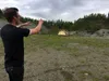 Chase Eckert, an owner of property at 4786 S. Glenn Highway near Palmer, demonstrates where he plans to construct several lanes in the outdoor shooting range planned for the property. The bus