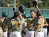 Mat-Su Miners infielder Rainer Ausmus (29) celebrates with teammates as he crosses home plate after hitting a grand slam during Mat-Su's 13-3 win over the Anchoage Bucs in Game 2 of the best-