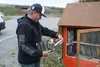 Denali Harley Davidson general manager Fred Becker looks at used books that are new to him. Jacob Mann/Frontiersman