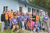 Members of the Cress family pose with volunteers for a final photo. Jenny Weaver/For the Frontiersma