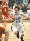 ROBERT DeBERRY/Frontiersman Palmer Moose Brennan Bohmangoes for
the steal during Tuesday game against the wasilla Warriors.