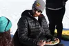 Wade Marrs, of Willow, talks to a reporter while enjoying a plate of steak and grains about an hour before the Willow restart of the 2016 Iditarod on Sunday. CAITLIN SKVORC/Frontiersman.com