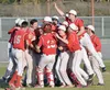 Wasilla celebrates winning its third straight Southcentral Conference tournament title after topping Soldotna 5-0 on Friday at Coral Seymour Memorial Park in Kenai. Photo by Jeff Helminiak/Pe