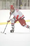 ROBERT DeBERRY/Frontiersman Wasilla freshman Michael Johnston
moves the puck down the ice for the Warriors during the first day
of the North Star Conference tournament. After scoring a 4-0 wi