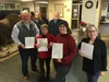 MLCC President Camden Yehle and Secretary Patti Fisher sign the deed to acquire 40 acres of land adjoining Meadow Lakes Community Park with Borough Manager Mike Brown, Community Development D