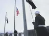 Members of the Colony High School Junior ROTC raise three flags
at the start of Friday’s Veterans Day ceremony at the Veterans Wall
of Honor in Wasilla. (ROBERT DeBERRY/Frontiersman) Robert D