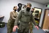 U.S. Air Force Capt. Jon “Dexter” Keranen, a F-22 pilot assigned to the 3rd Operations Support Squadron, is outfitted by air flight equipment technicians with a newly received state-of-the-ar