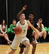 Colony senior Sullivan Menard makes a move to the basket during a 4A boys quarterfinal win over West Valley Thursday, March 21, 2019, in Anchorage. Jeremiah Bartz/Frontiersman