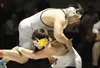Colony’s Ian MacKenzie picks up Wasilla’s Quace Wright during the 220-pound final at the ASAA/First National Bank 4A State Wrestling Championships at Bartlett High School Saturday evening. RO
