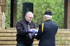 Allen Shepherd accepts a flag from a member of American Legion Post 35 in honor of his son Sealth. Jacob Mann/Frontiersman