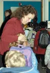 Nancy Nolfi-Dodge, administrative secretary at Big Lake
Elementary School, greets students as they arrive. Photo by AMY
MENEREY/Frontiersman.