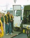 Palmer Lions Club members stand in front of the van they helped
to refurbish for the Palmer Senior Center. The van has a newly
renovated chair lift and a new motor, paid for in part by the
cl