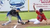 Cody Quelland of the Kenai Twins slides into third base as he ball gets away from Palmer's Alasdair McKechnie July 9 at Coral Seymour Memorial Ballpark in Kenai. Photo by Joey Klecka/Peninsul