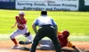 Wasilla infielder Taylon Ottinger tries to put the tag on a West Valley baserunner in a 10-0 win over the Wolfpack during the quarterfinal round of the ASAA/First National Bank State Baseball