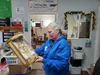 Family Promise Mat-Su Executive Director Ginger Bear examines a collectible doll donated for their upcoming community yard sale. Jacob Mann/Frontiersman