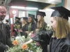 Members of the 2011 graduating class of Mat-Su Central School
pick out roses for their parents before the start of Monday’s
graduation ceremony held at Mat-Su Career and Technical High
School
