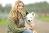 ROBERT DeBERRY/Frontiersman Amy Bunker and her dog Gumbo were
reunited after Gumbo become lost in the Hatcher Pass area. The
border collie spent six days avoiding bears and abandoned mine
sha