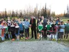 Wasilla Youth Soccer Association Executive Director Lisa Catlett, left, and Wasilla Mayor Bert Cottle cut the ribbon on the second soccer field at the Bumpus soccer complex Wednesday. CHRIS F