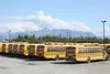 Buses sit ready to go at the First Student lot off the Palmer-Wasilla Highway. The company said a temporary shortage for drivers will mean some students are late to class on the first day of 