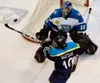 KELLY GILLIN/Wenatchee World Nardo Nagtzaam of the Alaska
Avalanche tries to bat a puck at Wenatchee Wild goalie Mathieu
Dugas. Wenatchee used a 4-2 win on Friday to take a 2-1 first-round
pl