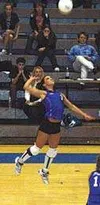 Palmer's Emily Mounce leaps high for a slam in the first game of
Thursday's match with Valdez. Photo by TIM BRODT/Frontiersman.
