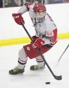 Wasilla forward Tanner Schachle handles the puck during a win over Palmer earlier this season. Schachle and the Warriors open the 2014 state tournament against Dimond Thursday at the Menard A