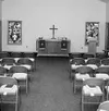 The altar of the new Lamb of God Lutheran Church is handmade,
and is framed by two stained-glass windows. CASEY
RESSLER/Frontiersman