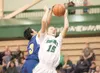 ROBERT DeBERRY/Frontiersman Kodiak'€™s Brian Fanganilo gets a
hand on the jump shot of Colony'€™s Scott Herman during Friday'€™s
game at Colony High School.