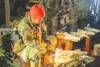 U.S. Air Force Senior Airman Keithsran Khem, a member of the 11th Air Force Arctic Resiliency Training cadre, demonstrates proper fire starting techniques during ART at Camp Madbull on Joint 