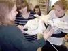 Jaymee Rousey, Noel Bowe and Rebecca Aubert ease the skull of a
moose onto a metal frame holding the animal’s legs and spine during
Faith Brunnhoelzl’s anatomy and physiology class on Friday.