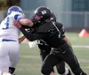 Colony senior Jarrett Villastrigo pushes the defender wide early in the season during a win over Palmer. Villastrigo has been named the Railbelt Conference Lineman of the Year. Courtesy of Br