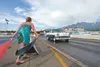 A car rockets off the starting line as Michelle Maynor drops the flag at the Thunder Valley Flag Drags at the Alaska Raceway Park in the Butte. Frontiersman file photo