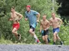 Palmer's Eric Strabel, far right, and Lyon Kopsack, second from right, follow Anchorage's Jacob Kirk and another runner up the Mount Marathon race trail where the road meets the mountain in S
