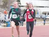 Colony’s Audrey Michaelson, left, and Wasilla’s Peggy Mathis dash for the finish line during the 1,600-meter run at the Region III Track and Field Championships at Palmer High School last wee