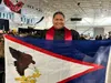 Graduate Kiderro Fono holds his flag from America Samoa during the HJSH graduation. Katie Stavick/Frontiersman