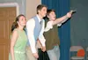 Taneisha Godden, left, playing the part of Linda, practices shooting with Zack Hardy, right, who plays her friend Mickey, and his twin brother separated at birth Edward (Clint Dallas). ‘Blood