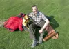 Chris Longacre sits with some of his essential climbing gear at his Valley home. Longacre just completed a summit of Mt. Everest. With the summit of Everest, he has now climbed the tallest pe