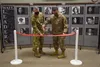Col. Brian Collins, 62nd Airlift Wing vice commander, and Chief Master Sgt. Joseph Arce, 62nd AW command chief, cut a ribbon during the grand-opening ceremony for the Martin Luther King Jr. a