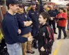 Central Mat-Su Fire and Rescue's Nathan Durbin shakes hands with Spencer Koval, 11, during a thank-you ceremony at Central Mat-Su Fire Station 6-1 in Wasilla. Robert DeBerry