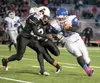 Palmer’s James Nisbett gets past West Eagle Jordan Murchinson during Friday’s semifinal game at the ASAA state playoffs at the Anchorage Football Stadium. ROBERT DeBERRY/Frontiersman.com