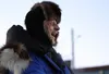 Martin Buser laughs at something said by a nearby supporter of rookie Big Lake musher Tim Pappas, who had just finished his first Iditarod on Thursday night. Buser, who said he considers Papp